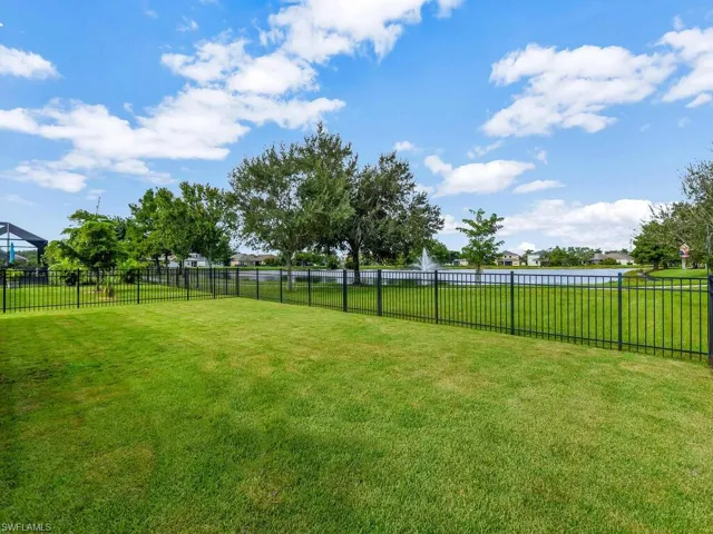 View of yard with a water view