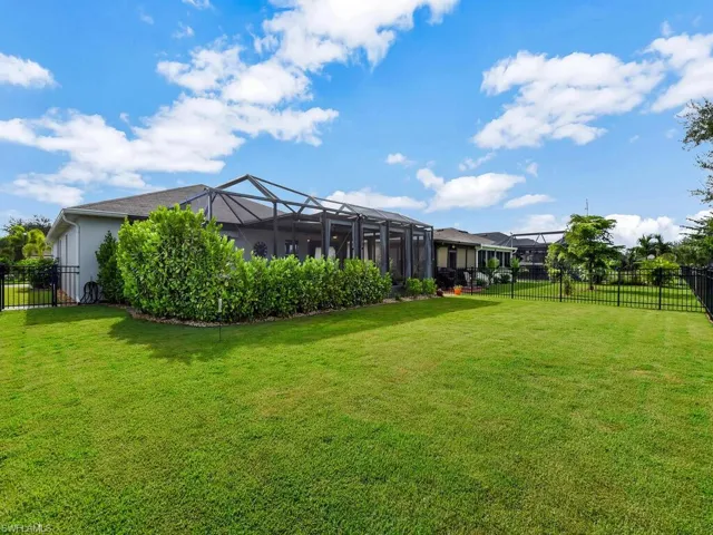 View of yard featuring a lanai and a sunroom