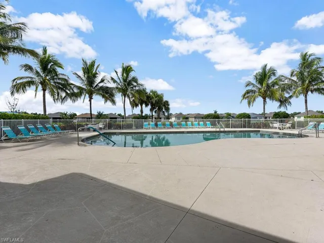 Community pool featuring a patio