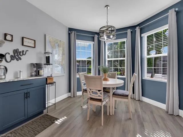 Dining space with light wood-style floors