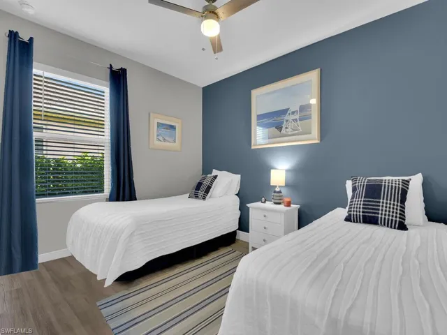 Bedroom featuring a ceiling fan and wood finished floors