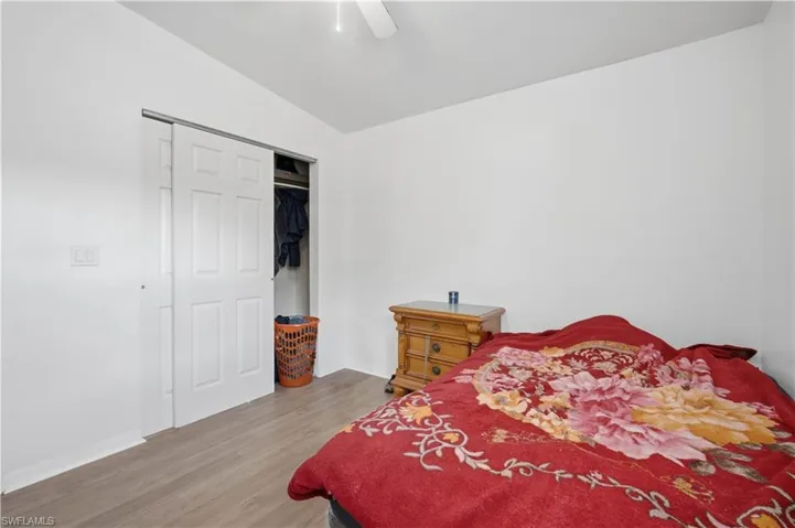 Bedroom featuring light wood-finish flooring and a white ceiling