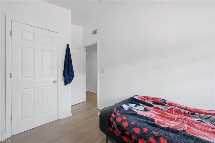 Light wood-finish flooring extending throughout the space