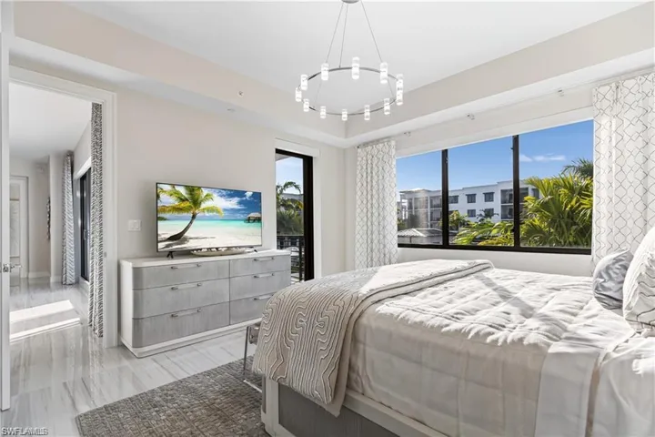 Bedroom with a notable chandelier