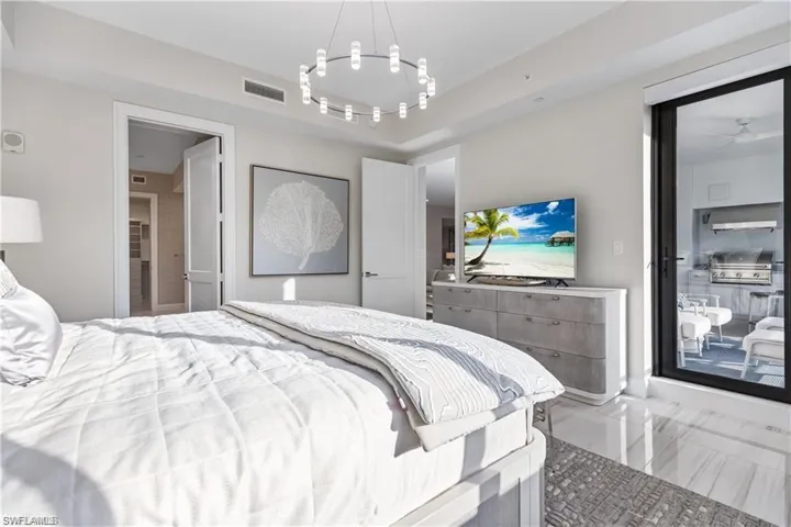 Bedroom with a raised ceiling
