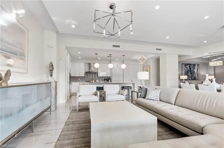 Living room featuring a chandelier