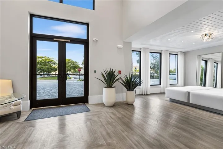 Entryway with french doors, parquet floors, and wood ceiling