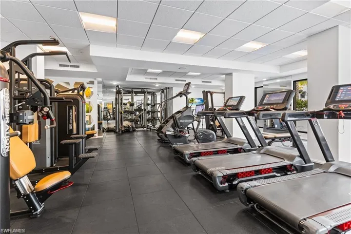 Workout area featuring a drop ceiling