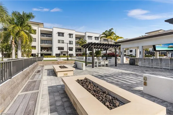 dining area, a pergola, and an outdoor fire pit