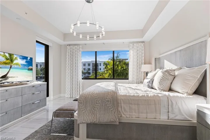Bedroom with a tray ceiling