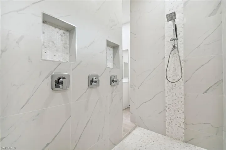Bathroom featuring a tile shower