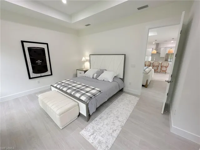 Bedroom with light hardwood / wood-style floors