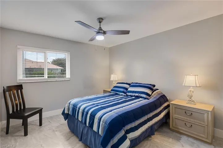Bedroom featuring baseboards and a ceiling fan