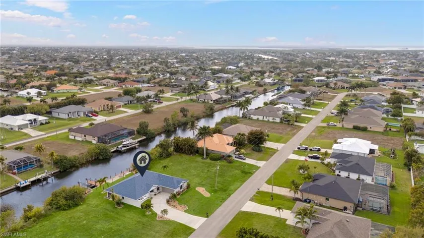 Aerial view of residential area with a large body of water