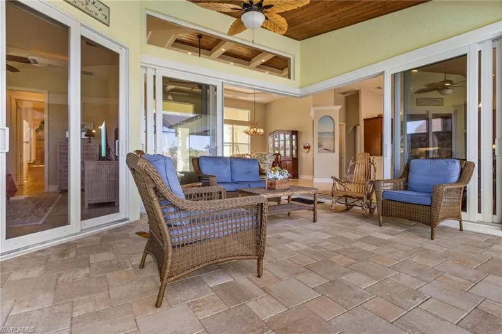 Lanai/Sunroom with tongue and groove accent and ceiling fan