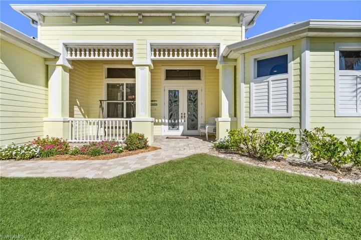 Entrance to home with covered porch