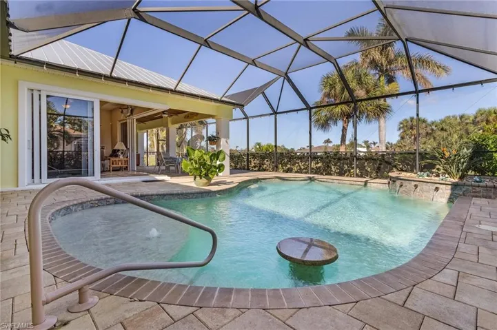 View of swimming pool with quality screened cage