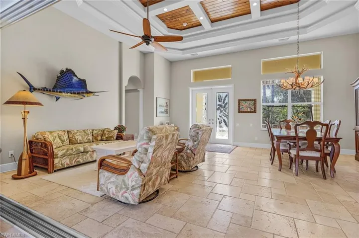 Living room with tray ceiling and tongue-groove cypress inlays