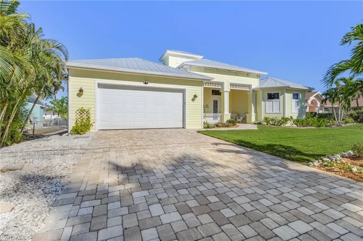 View of front of house featuring paver driveway
