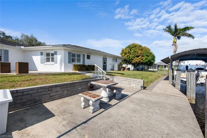 View of patio / terrace featuring central AC and a dock