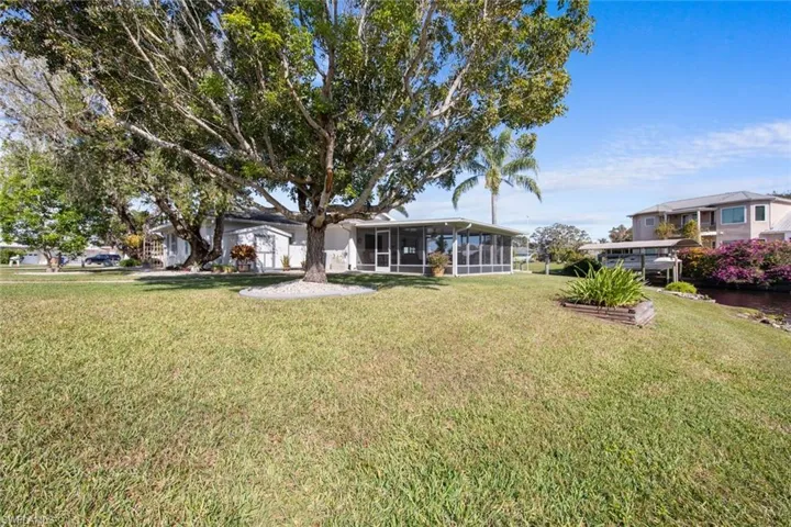 View of yard featuring a sunroom