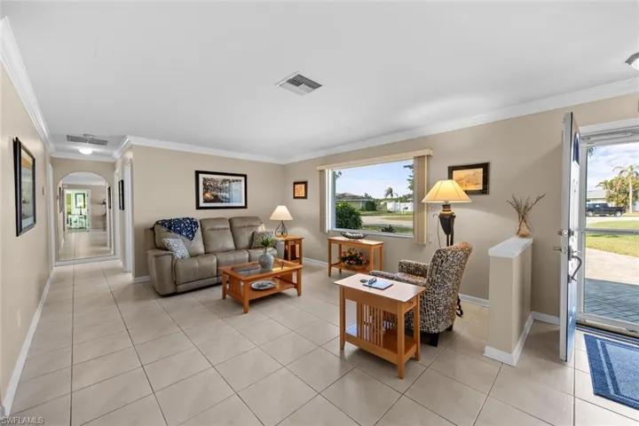 Tiled living room with ornamental molding