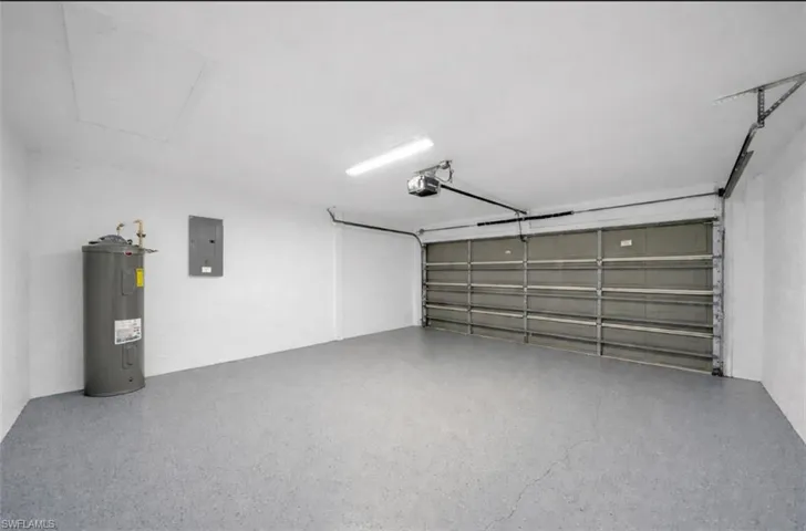 Garage with electric panel and water heater