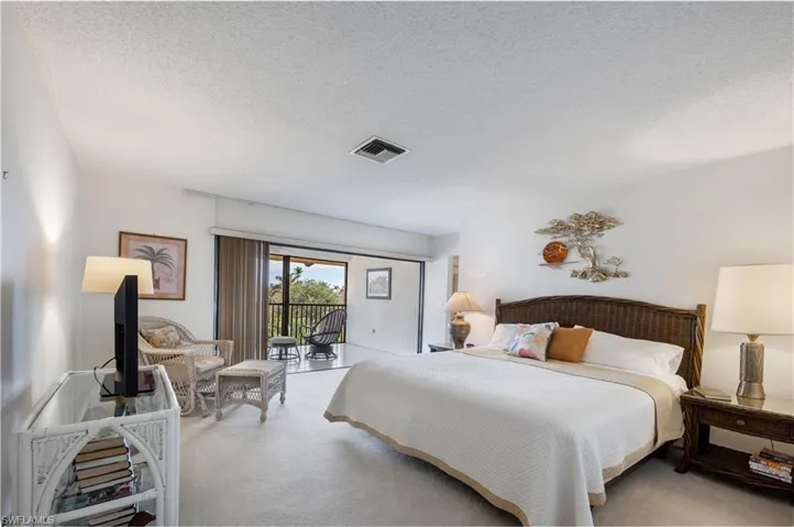 Master bedroom with view to lanai and canal
