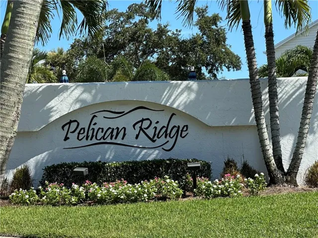 Community / neighborhood sign with a yard
