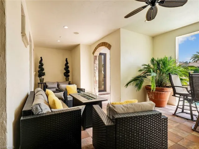 Ground Level Outside Sitting area with a fire pit featuring the pool bathroom