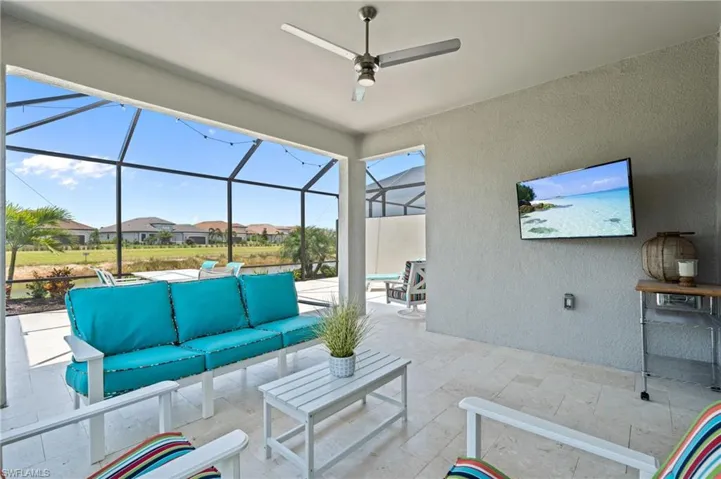 View of patio with an outdoor hangout area, a ceiling fan, a lanai, and a residential view