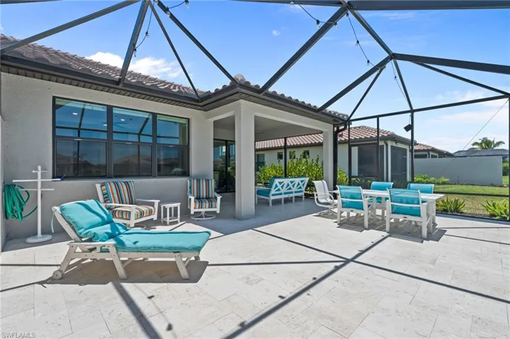 View of patio with a lanai and outdoor dining space