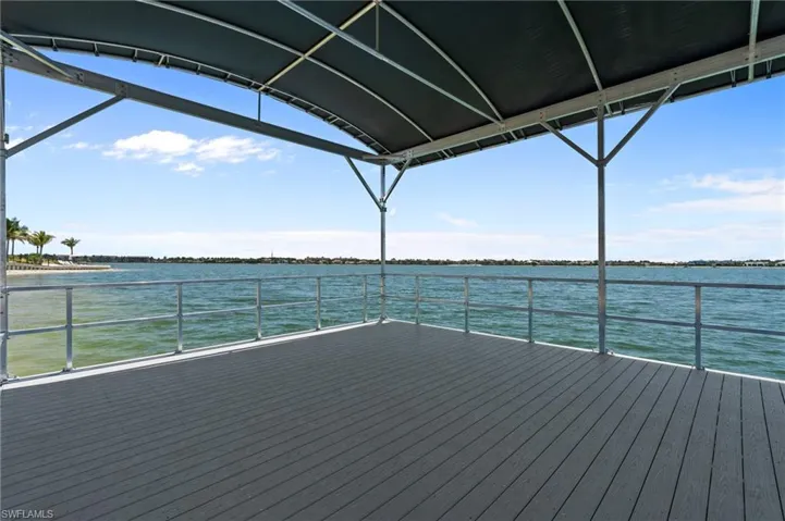 Wooden terrace featuring a water view