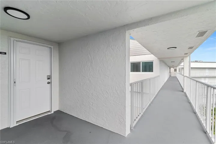 Doorway to property with stucco siding