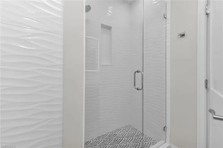 Full bath with a shower stall