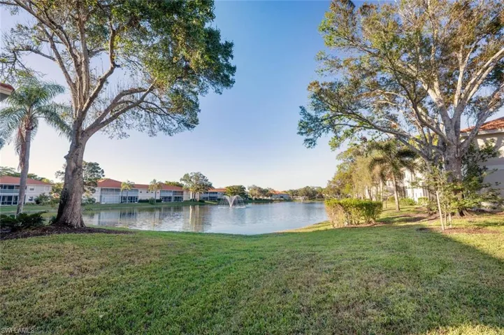 View of yard with a water view