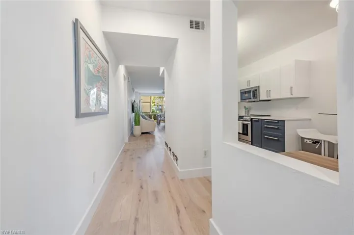 Hallway with light wood-type flooring