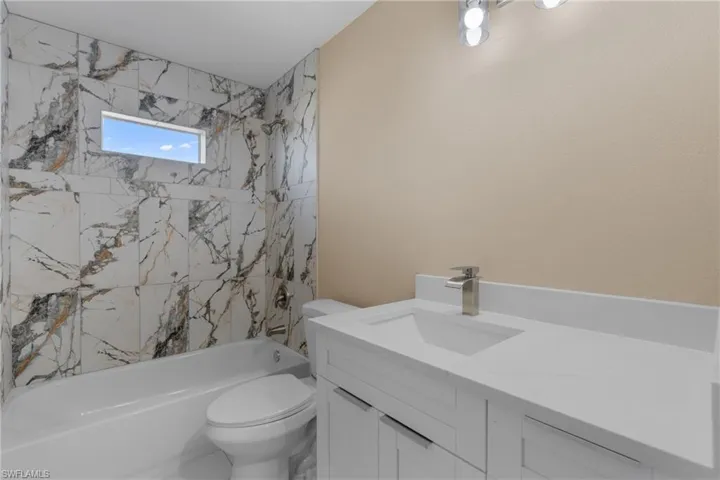 Bathroom with vanity and shower / bathtub combination