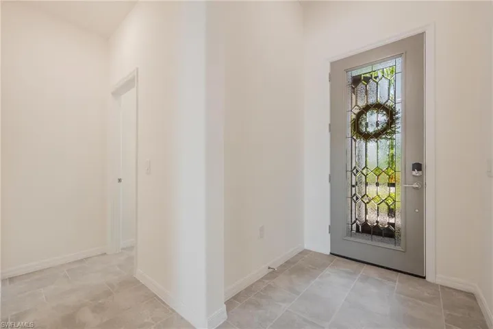 Foyer with light tile floors