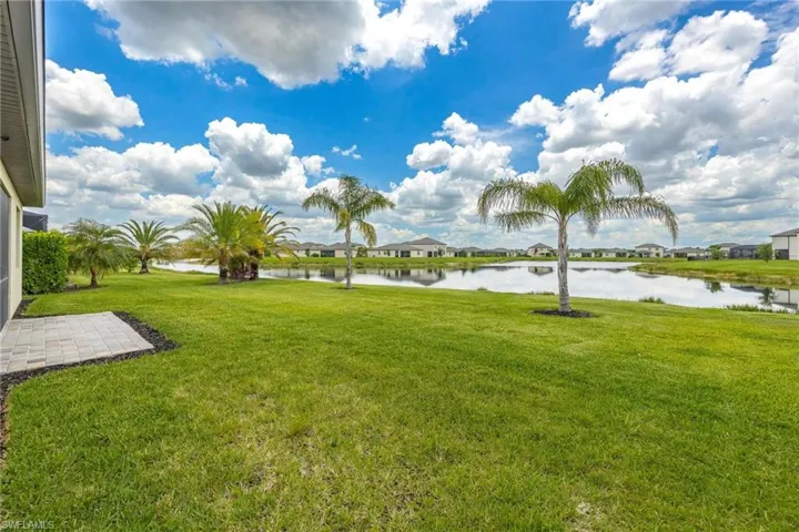 View of yard with a water view