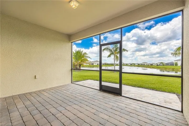 Unfurnished sunroom featuring a water view