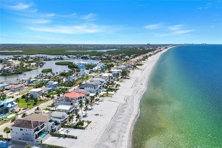 Aerial perspective of suburban area featuring extended coastline