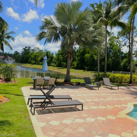 View of property's community with a patio and a water view