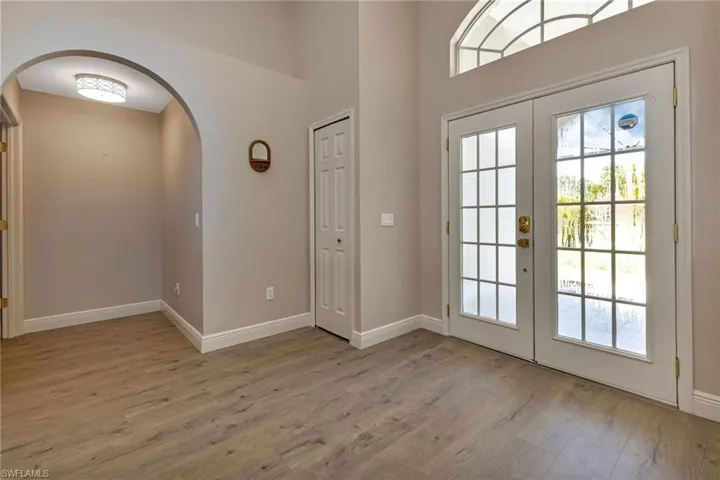 Doorway featuring french doors and hardwood / wood-style floors