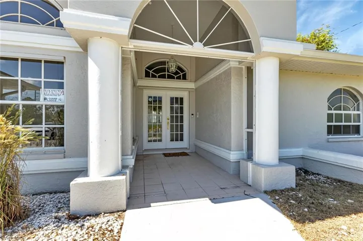 Property entrance with french doors