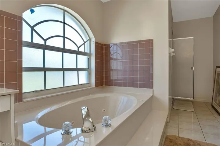 Bathroom featuring a tub and tile patterned floors