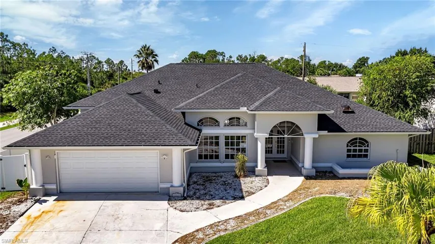 View of front of property with a garage