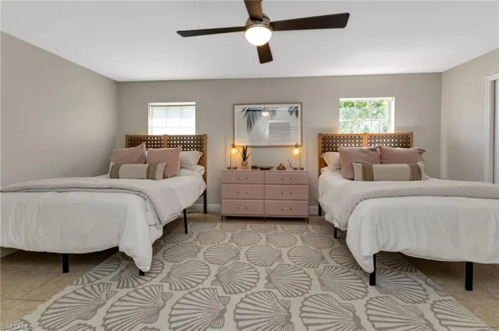 Tiled bedroom with ceiling fan