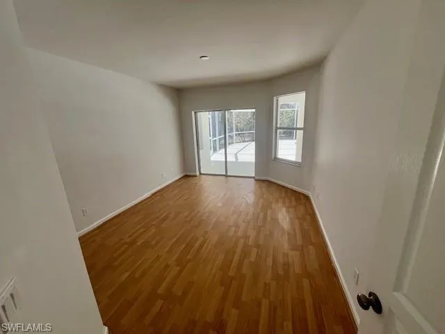 Empty room featuring light wood-style flooring and baseboards
