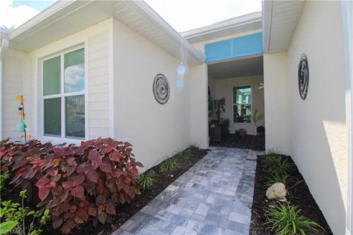 Doorway to property with stucco siding